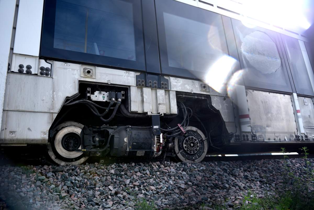A wheel of a segment of an OC Transpo O-Train is seen off the tracks  Monday, Sept. 20, 2021 after it derailed west of Tremblay LRT Station on Sunday, in Ottawa. 