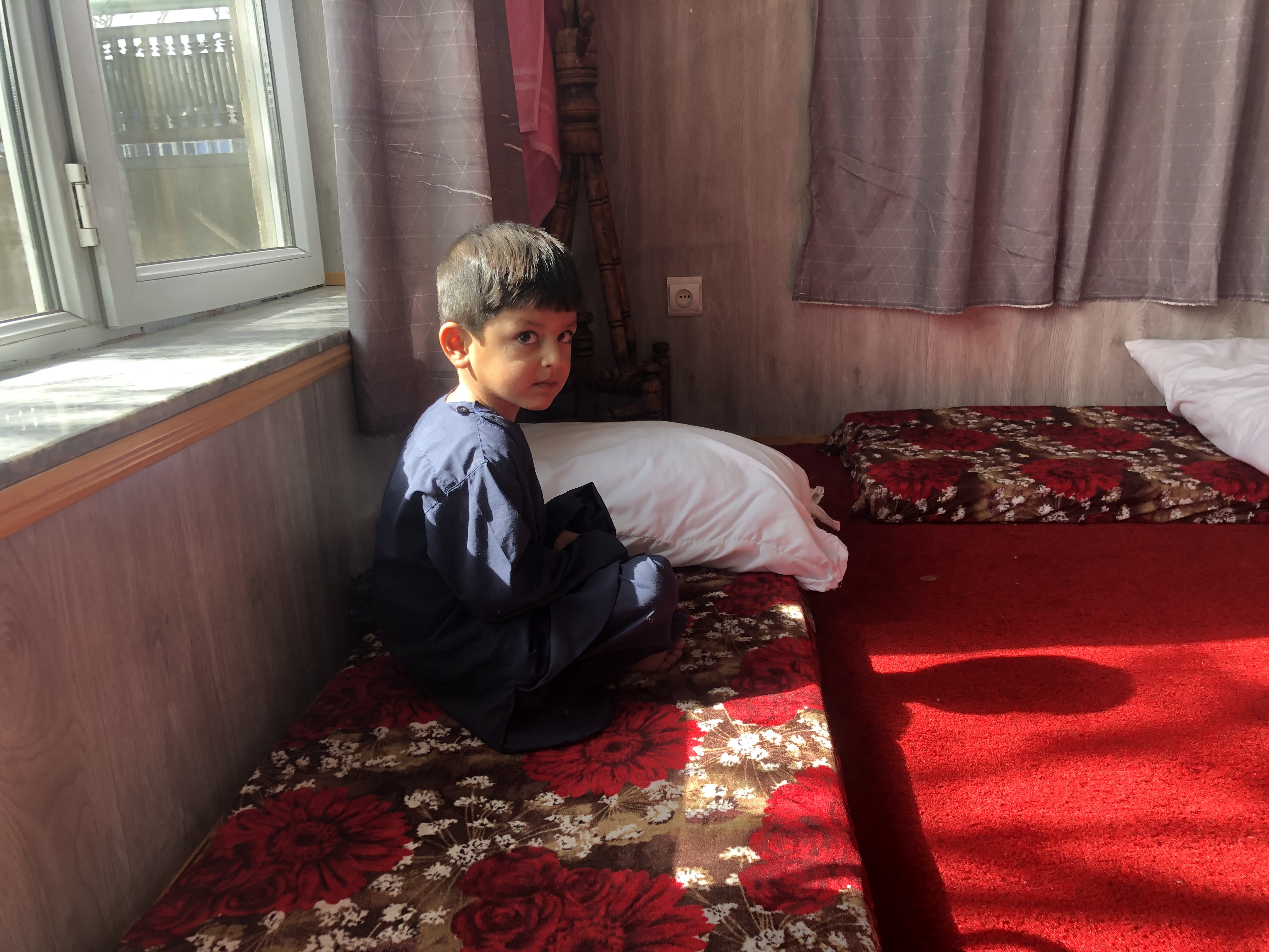 Boy at a Kabul safe house for Afghans awaiting evacuation to Canada.