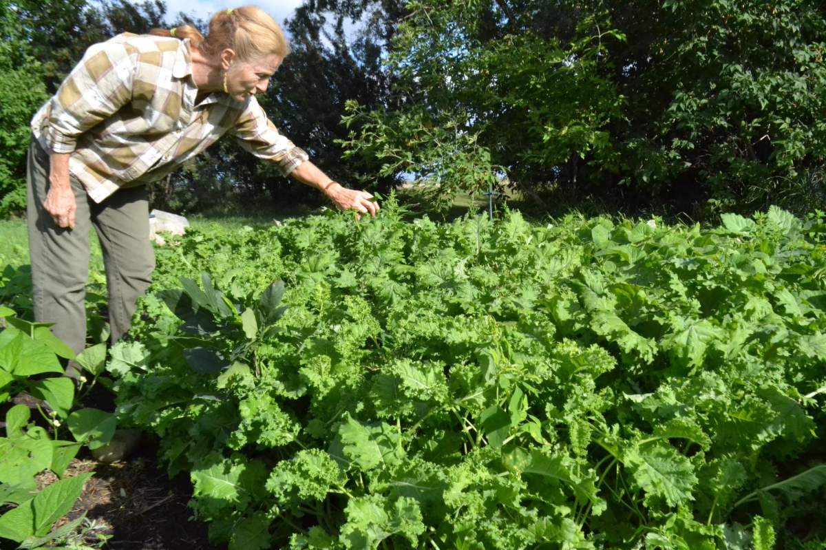 Swain on her farm in New Bothewell, Man.
