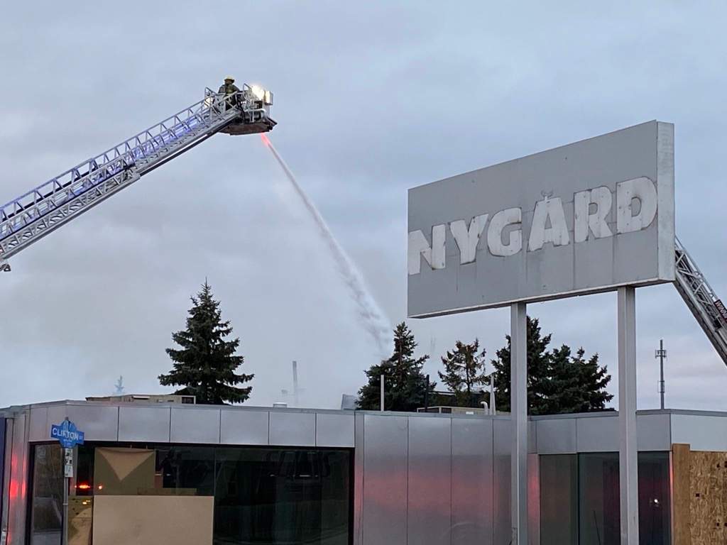 Firefighters tackle a blaze at the former Nygard Warehouse on Notre Dame Avenue on Tuesday, Oct. 19, 2021.