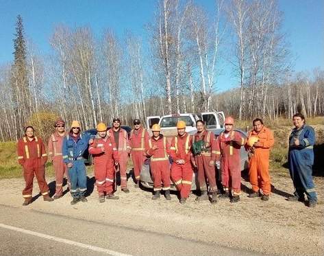 Fire fighters assembled to protect Shoal Lake and Red Earth Cree Nations.