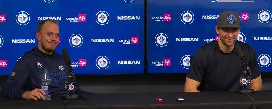 Winnipeg Jets players Nate Schmidt and Blake Wheeler speak with media following a practice at Canada Life Centre/Winnipeg Jets