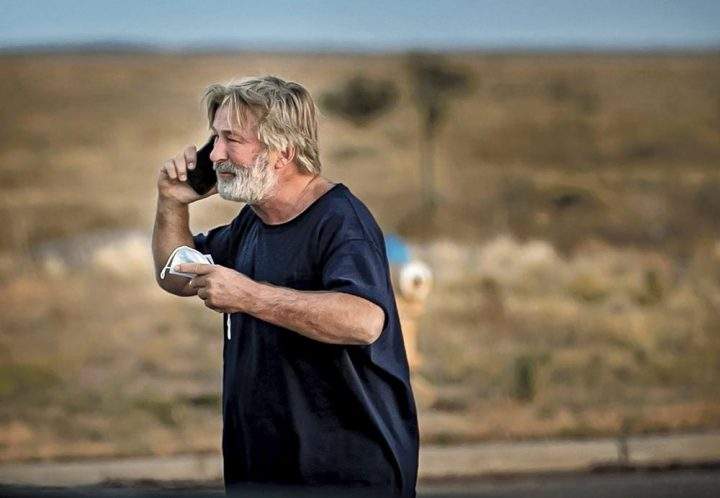 Alec Baldwin speaks on the phone in the parking lot outside the Santa Fe County Sheriff's Office in Santa Fe, N.M., after he was questioned about a shooting on the set of the film "Rust."