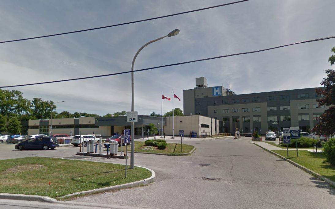 An outdoor, sunny photo of a hospital.