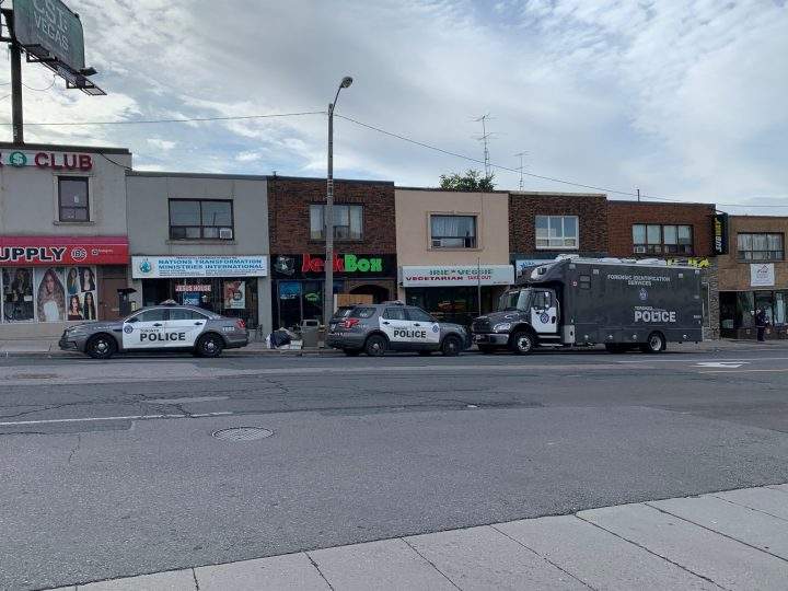 Police at the scene of a fatal shooting near Eglinton Avenue and Trethewey Drive on Saturday.