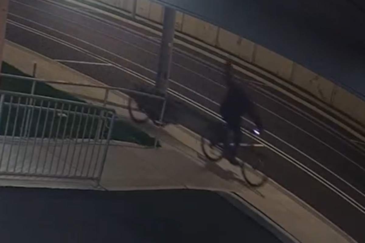A video shows a man on a bike throwing an object at the pharmacy.