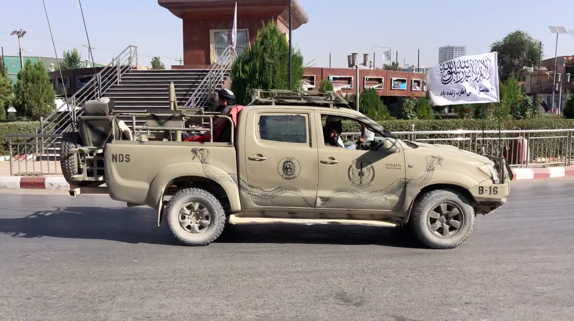 Gunmen in truck flying Taliban flag in Kabul.