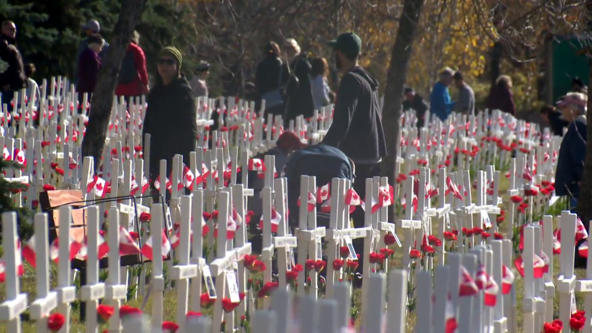 Calgary students placed poppies at the Field of Crosses on Sunday, Oct. 24, 2021.
