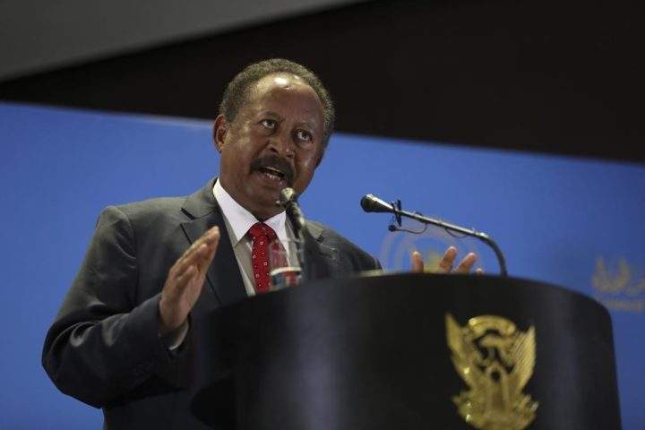 FILE - Sudanese Prime Minister Abdalla Hamdok announces new cabinet in Khartoum, Sudan, Feb. 8, 2021.
