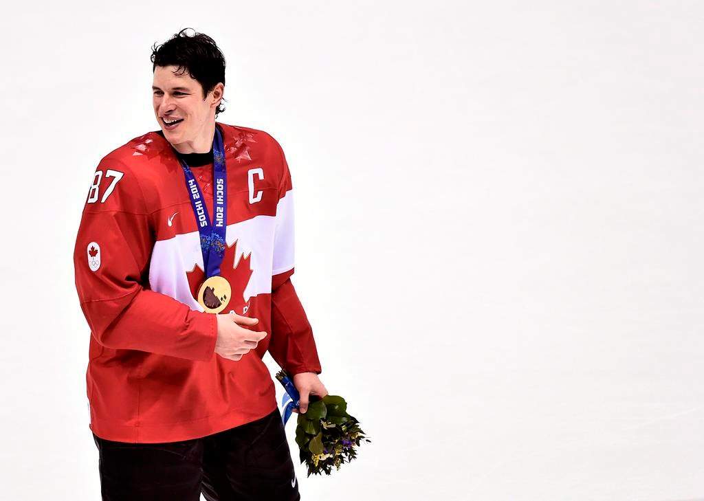 Canada captain Sidney Crosby smiles with his gold medal after Canada defeated Sweden during third period finals hockey action at the 2014 Sochi Winter Olympics in Sochi, Russia on February 23, 2014. THE CANADIAN PRESS/Nathan Denette