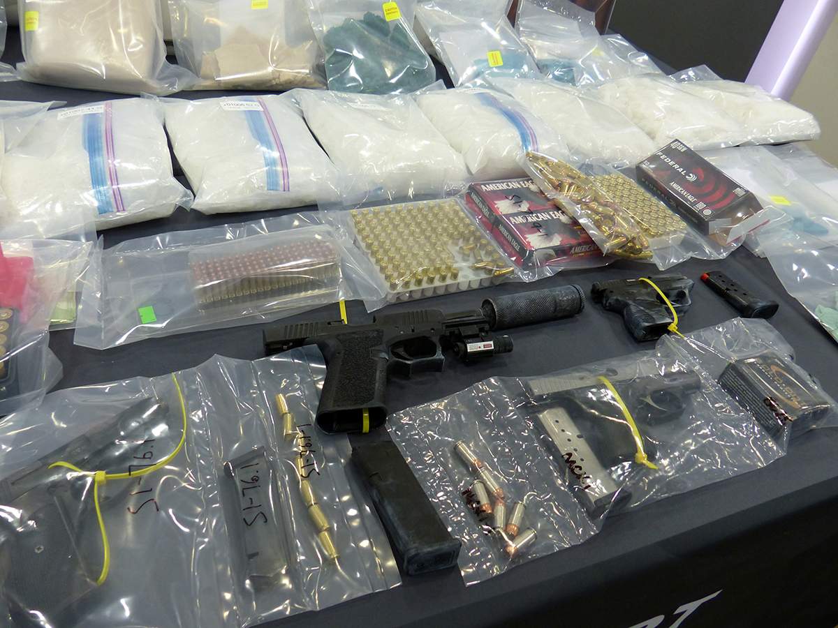 Firearms, ammunition and $1 million in drugs was seized during coordinated searches in Edmonton, Red Deer and Whitecourt earlier this month.