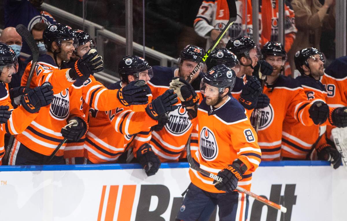 Edmonton Oilers’ Kyle Turris (8) celebrates a goal against the Vancouver Canucks’ during shootout NHL action in Edmonton on Wednesday, October 13, 2021.