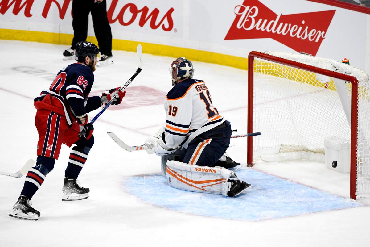 Winnipeg Jets’ Pierre-Luc Dubois (80) scores on Edmonton Oilers goaltender Mikko Koskinen (19) during the second period of NHL action in Winnipeg, Tuesday, Nov. 16, 2021.