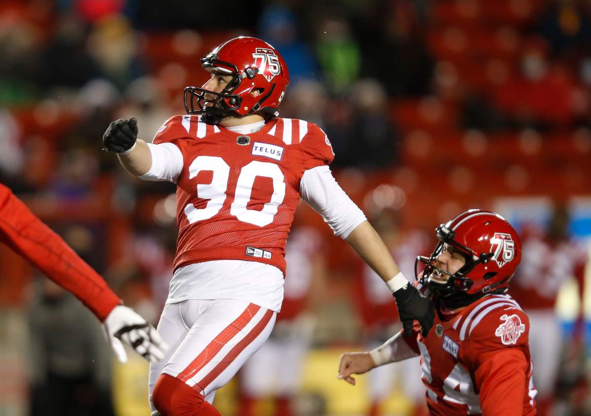 Calgary Stampeders Rene Paredes watches his game winning field goal with Cody Grace against the Winnipeg Blue Bombers during the second half of their CFL football game in Calgary, Saturday, Nov. 20, 2021.THE CANADIAN PRESS/Todd Korol