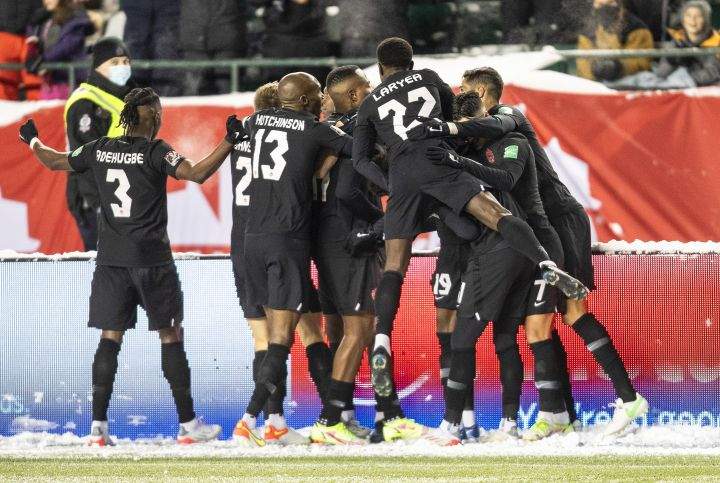 Canada players celebrate a goal against Mexico during World Cup Qualifiers in Edmonton, Tuesday, Nov. 16, 2021.