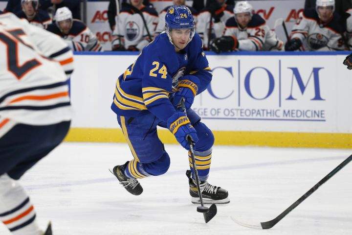 Buffalo Sabres centre Dylan Cozens (24) carries the puck during the first period of the team’s NHL hockey game against the Edmonton Oilers, Friday, Nov. 12, 2021, in Buffalo, N.Y.