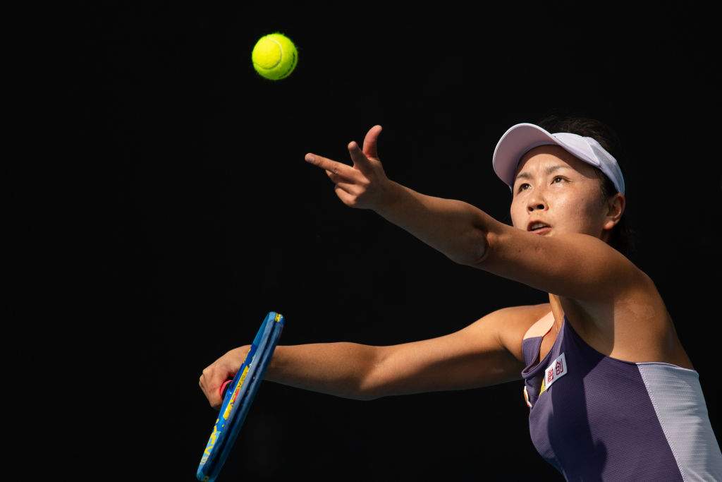Peng Shuai serves a tennis ball to an opponent