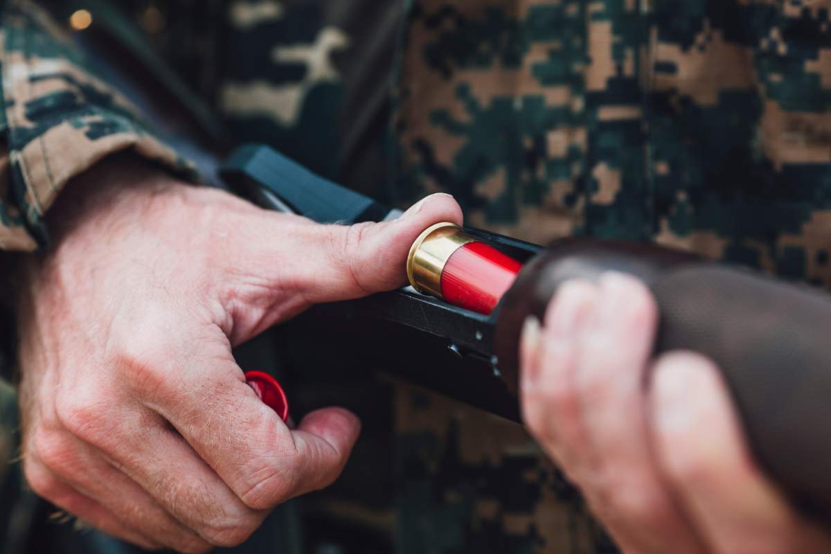 a stock image of a rifle being loaded