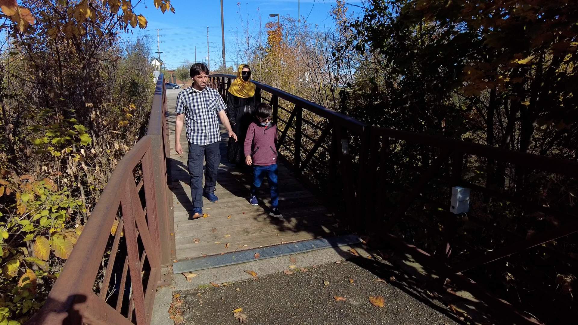 Mohammad Ismail, his wife Pahima and their son Himat explore a park in Toronto after arriving in Canada.