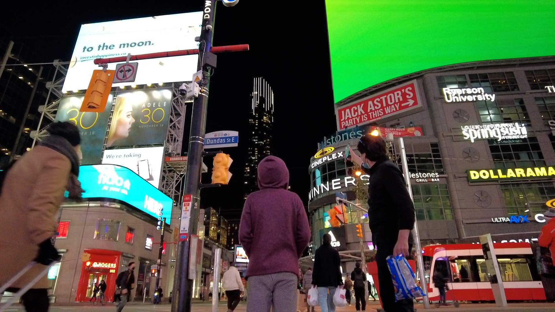Afghan refugees Mohammad Ismail and his son, Hamit, visit Yonge-Dundas square in Toronto for the first time.