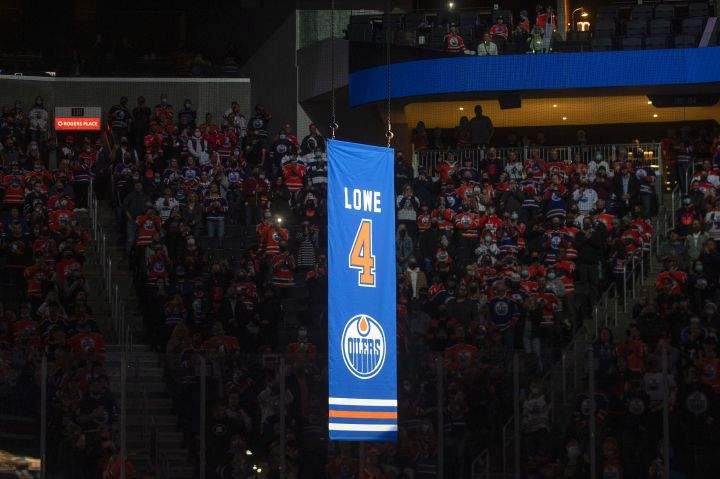 Former Edmonton Oilers player Kevin Lowe’s jersey is lifted to the roof during his jersey retirement ceremony in Edmonton on Friday, November 5, 2021.