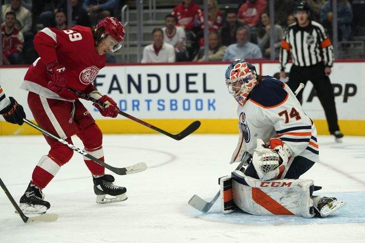 Edmonton Oilers goaltender Stuart Skinner (74) stops a Detroit Red Wings left wing Tyler Bertuzzi (59) shot in the second period of an NHL hockey game Tuesday, Nov. 9, 2021, in Detroit.