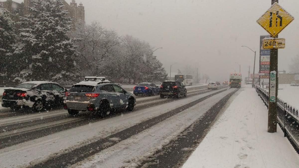 FILE - Cars driving along Main Street East in Hamilton Ont. in December 2020. After a relatively mild December 2023, winter is set to hit Hamilton in January 2024.