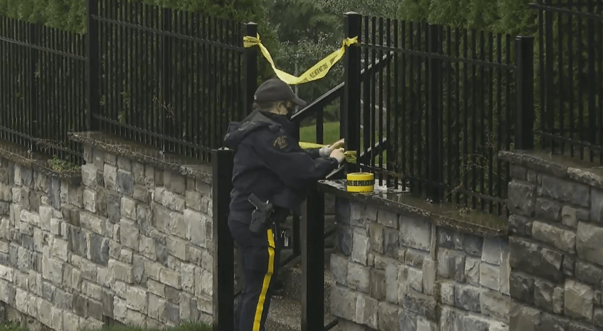 Surrey RCMP place caution tape around a South Surrey, B.C. home where a man was shot on Nov. 25, 2021.
