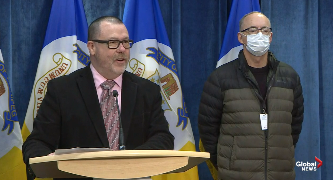 680 CJOB’s Kelly Moore honours his colleague Bob Irving at City Hall.
