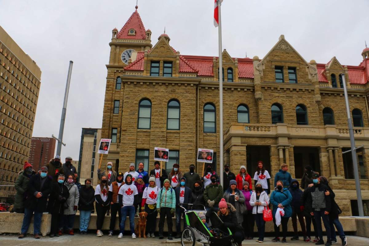 Supporters gather in front of Calgary City Hall on Sunday for the Find Mackenize rally.