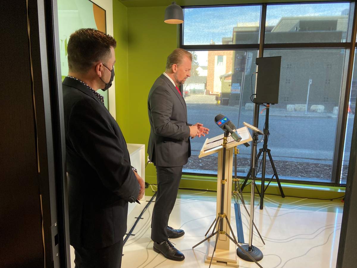 Minister Mike Ellis at media event.