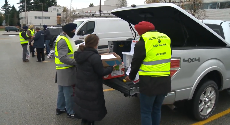 Sikh Nation volunteers set up at Princess Margaret Secondary in Surrey on Saturday.