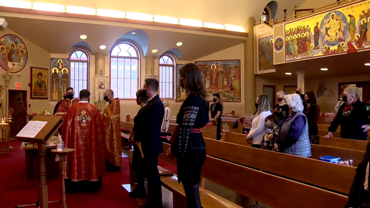 People sporting masks gathered in St. Vladimir's Ukrainian Orthodox Sobor in Calgary on Saturday, Nov. 27, 2021, to commemorate the anniversary of the Holodomor.