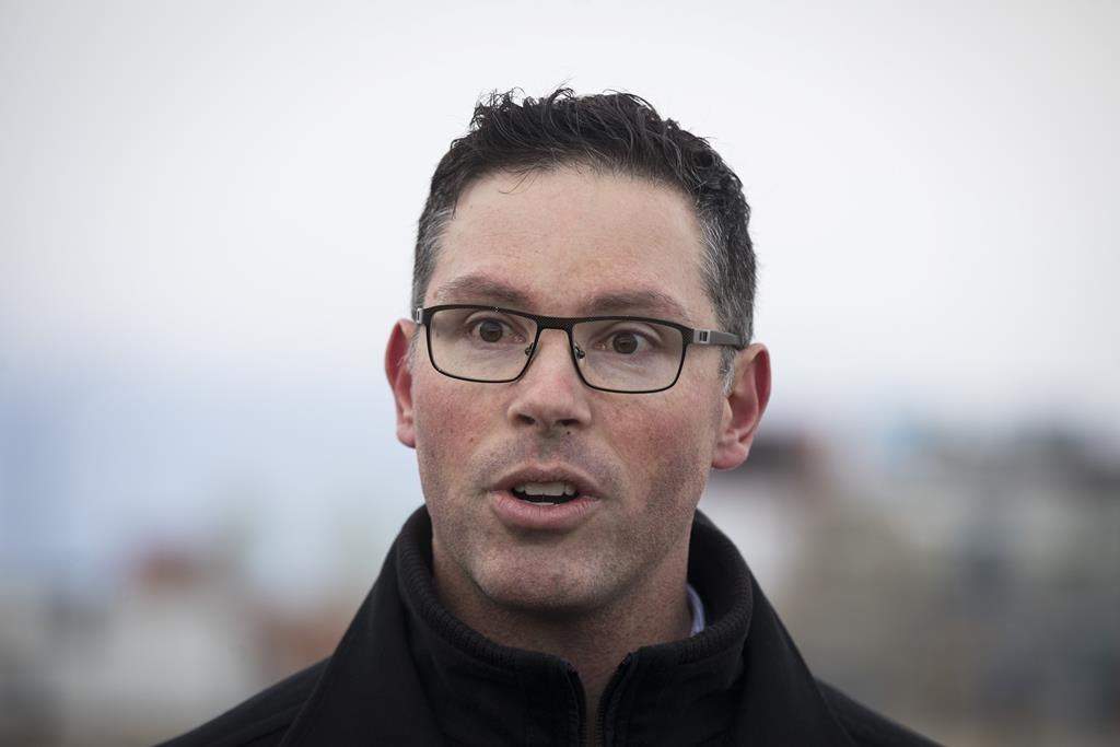 Alberta cabinet minister Doug Schweitzer makes a statement at a news conference. In a tweet on Friday afternoon, Schweitzer announced he has provided Premier Jason Kenney with his resignation from Cabinet.  THE CANADIAN PRESS/Todd Korol.