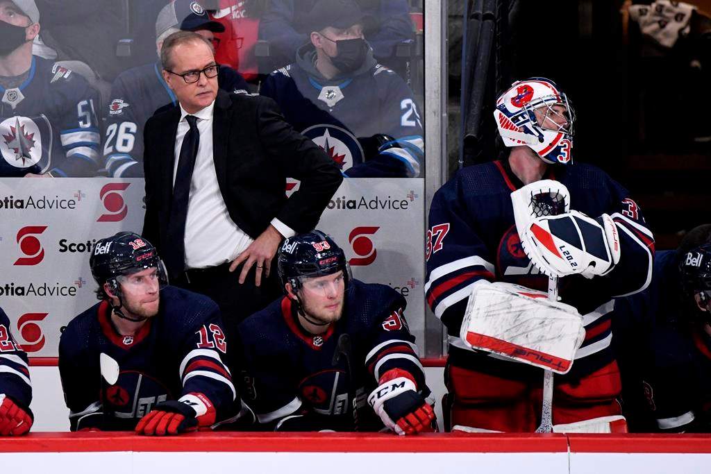 Former Winnipeg Jets head coach Paul Maurice behind the bench.