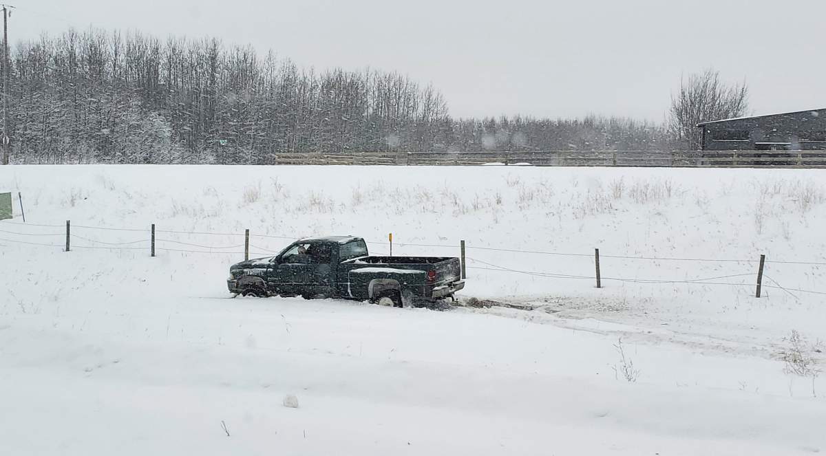 A truck in the ditch of Highway 16 near Spruce Grove, Alta. on Wednesday, Dec. 22, 2021.