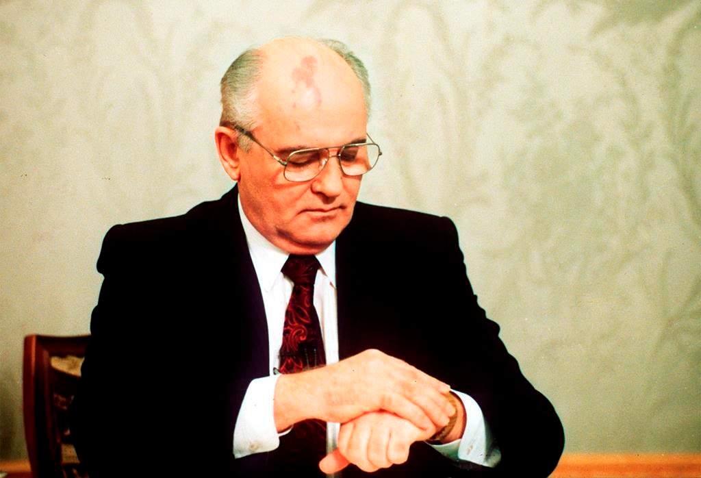Soviet President Mikhail Gorbachev checks the time on his watch before his resignation speech in the Kremlin on Wednesday, Dec. 25, 1991, drawing a line under more than 74 years of Soviet history.