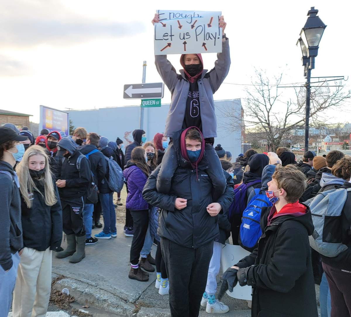 Dozens of student-athletes and supporting students took part in a walkout Tuesday, chanting, ‘Let us play.’