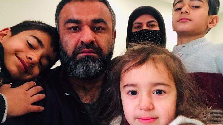 Naveed and Mashala, and their three children.