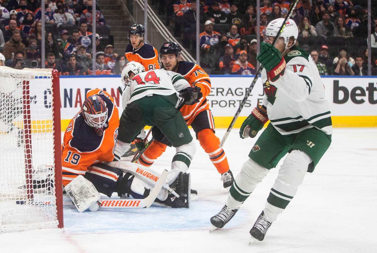 Minnesota Wild’s Marcus Foligno (17) scores on Edmonton Oilers goalie Mikko Koskinen (19) during first period NHL action in Edmonton on Tuesday, December 7, 2021.