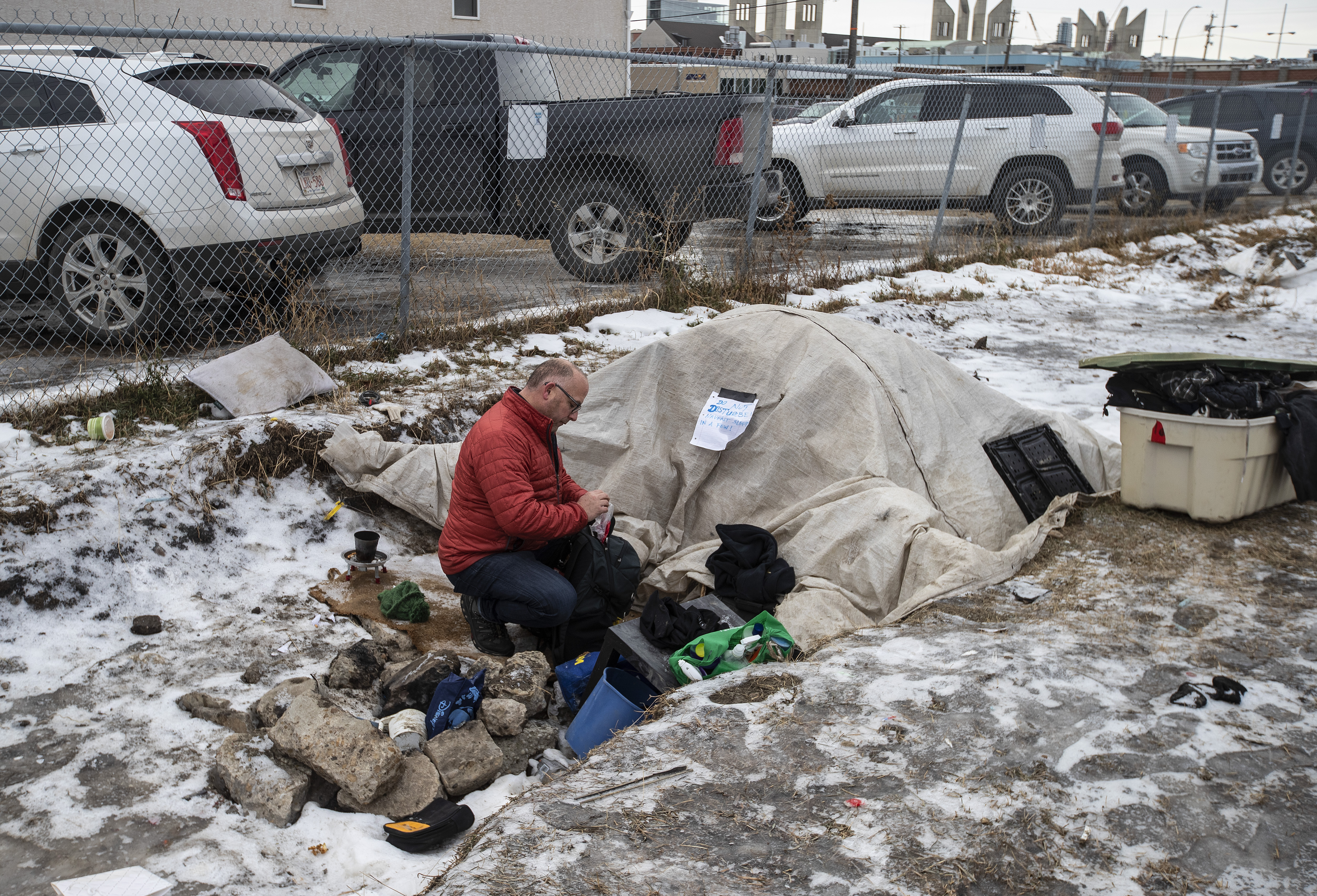 Manager of H.E.L.P. Team Boyle Street Community Services Doug Cooke checks on homeless people and hands out supplies in Edmonton, Thursday, Dec. 9, 2021.