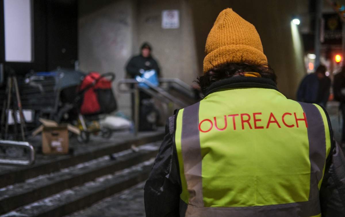 Outreach volunteers offer help to the homeless on a -20C night in Calgary, Alta., Tuesday, Dec. 14, 2021. 
