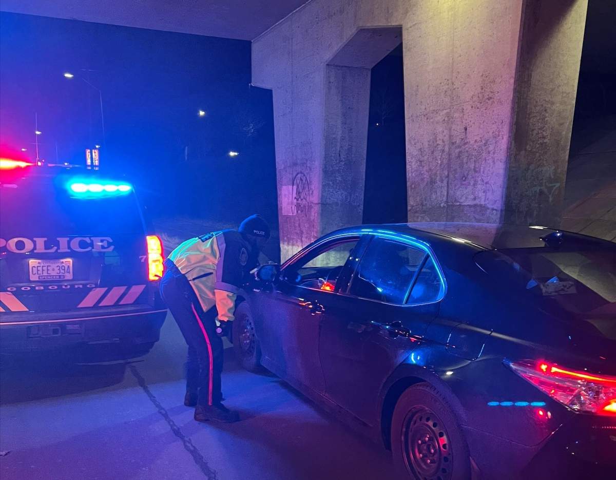 A Cobourg Police Service officer conducts a vehicle stop during a RIDE check.
