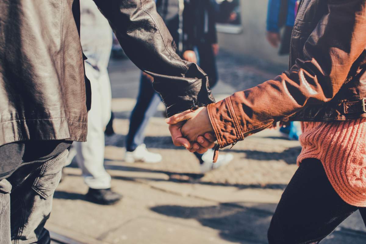 Hand in hand going couple.