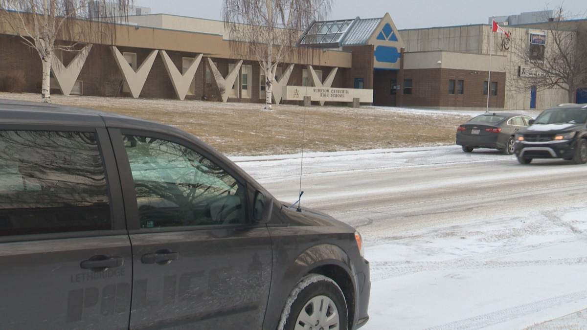 A Lethbridge police van parked outside Winston Churchill High School on December 14, 2021.