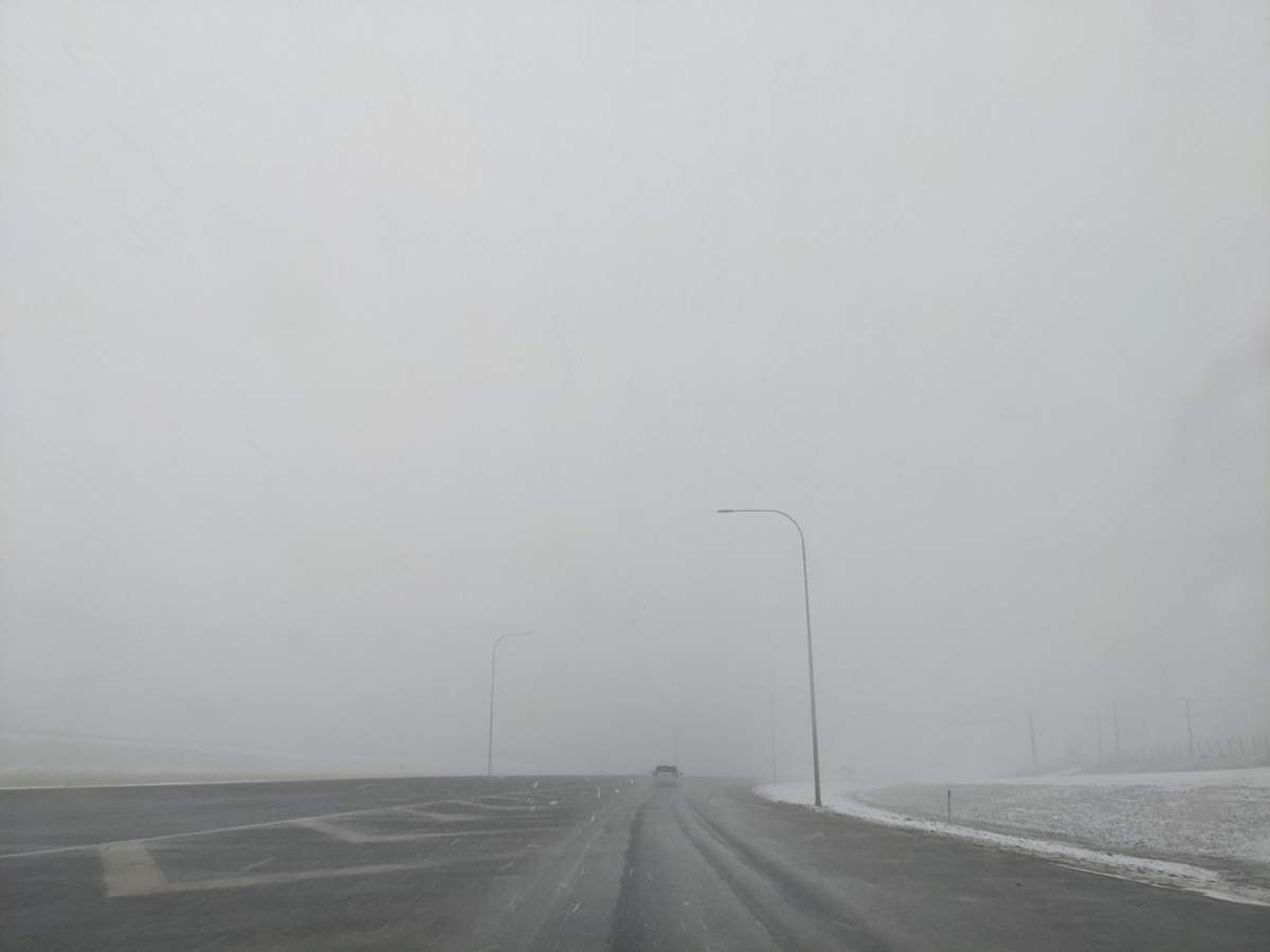 windy intersection in winter on Highway 2A
