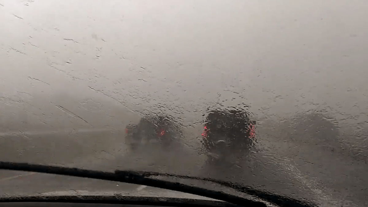 Passenger in SUV takes picture of heavy rain while on Highway 403 in Hamilton.