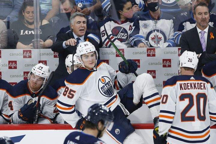 Edmonton Oilers head coach Dave Tippett talks to his players during second period pre-season NHL game action against the Winnipeg Jets in Winnipeg on Wednesday, September 29, 2021.