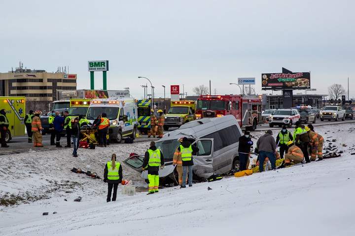 Emergency crews respond to the scene of a crash on Highway 20 West in Boucherville  on Monday, Dec. 27, 2021.