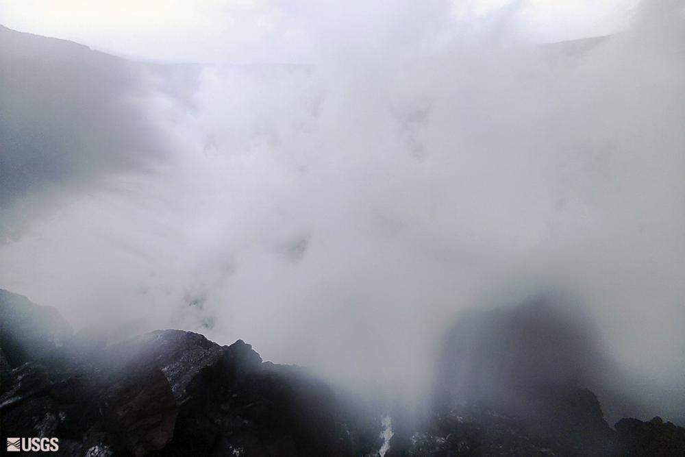 In this webcam image provided by the U.S.Geological Survey, steam rises from the west rim of the summit collapse on Kilauea in Hawaii, Monday, Dec. 6, 2021.